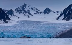 Expedition boat in-front of Monaco Glacier. Liefdefjorden (Love-fjord)