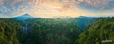 Tumpak Sewu Waterfall and Semeru volcano. Panorama