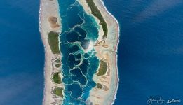 Caroline atoll — a jewel glittering in the midday sun Caroline atoll — a jewel glittering in the midday sun