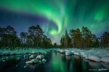 Northern lights over a non-freezing river Northern lights over a non-freezing river